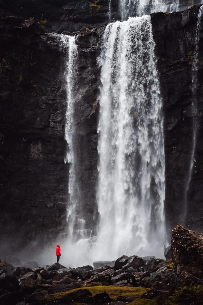 Person in front of waterfall