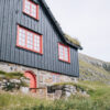 Black house with red painted windows