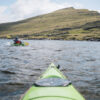 Kayaking on lake in Faroe Islands