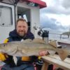 Man holding cod