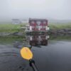 Kayaking with view of house