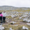 Man and lady next to cairn