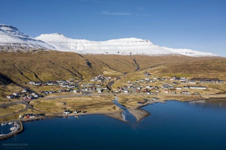 Aerial view of settlement with snow in mountains