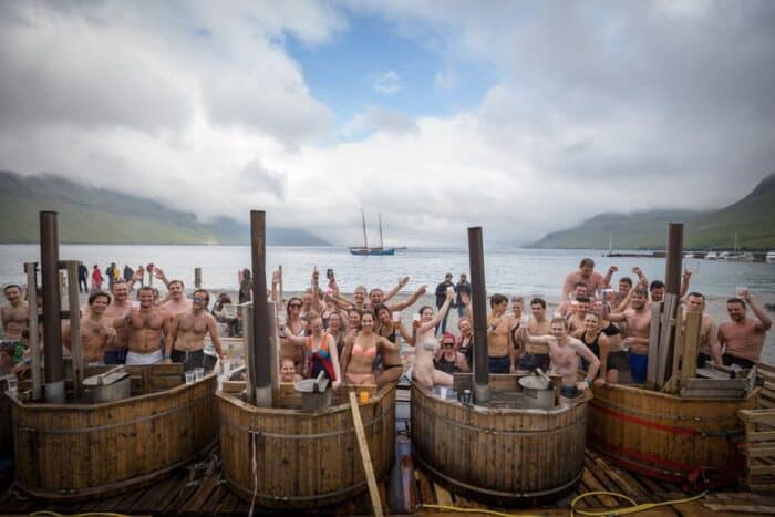 People in hot tubs on Eysturoy Island