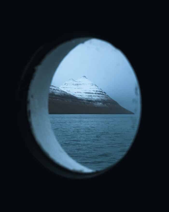 Ferry window with snowy mountain