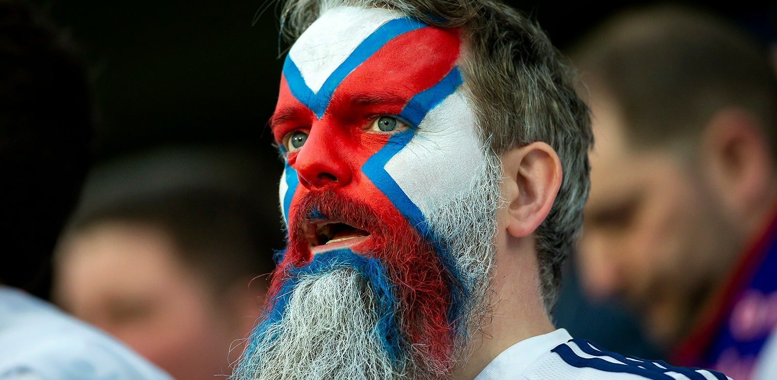 Face of man painted as Faroese flag