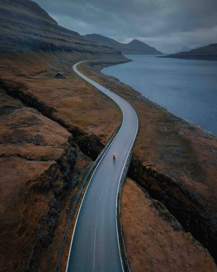 Man on road in the Faroe Islands