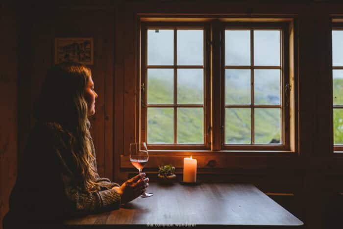 Lady looking out on grassy hillside