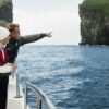 Man pointing at sea stack