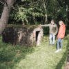 Man and lady next to bunker