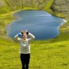 Lady in front of heart-shaped lake