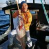 Man with fish in Faroe Islands