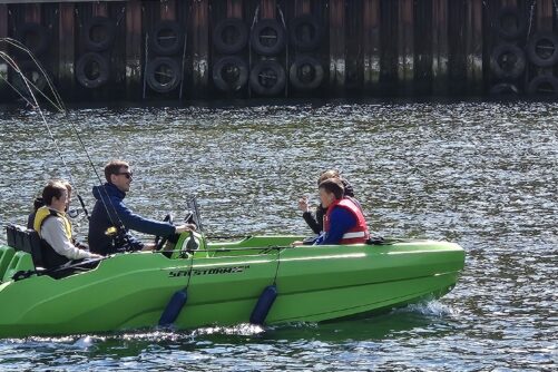 People on Green boat