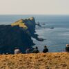 Travellers sitting on Mykines Island