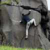 Climbing basalt wall in Faroe Islands