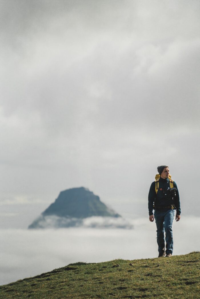 Man hiking in Faroe Islands