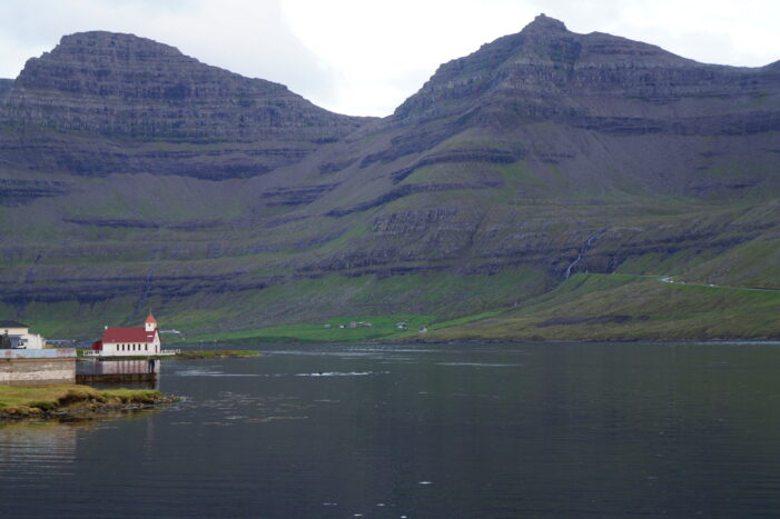 Church and steep mountains in Hvannasund