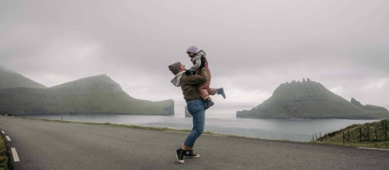 Mom holding child in Faroe Islands