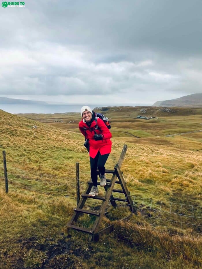 Lady on trail on Sandoy Island