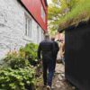Person walking cobbled stones