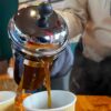 Pouring coffee into cup