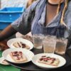 Waitress serving bread and soft drink
