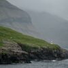 Lighthouse in rugged terrain