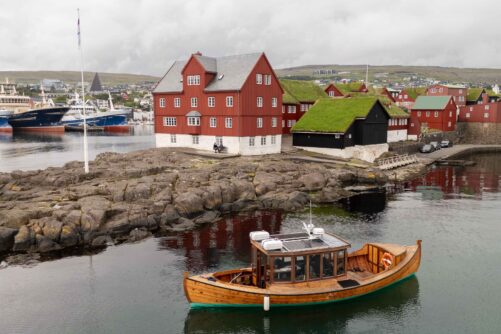 Cruising next to Tinganes Peninsula in Tórshavn.